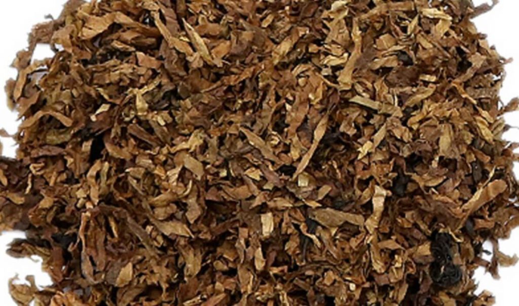 A pile of bulk Burley tobacco leaves